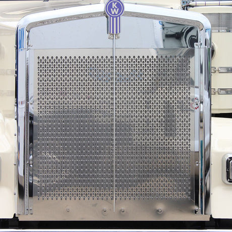 Close-up of Kenworth W900L extended hood grill with keyhole punch