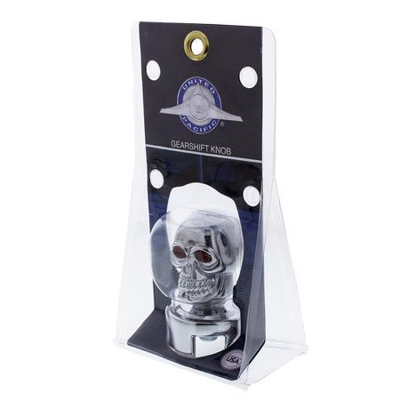 Close-up of chrome skull gear shift knob with red eyes
