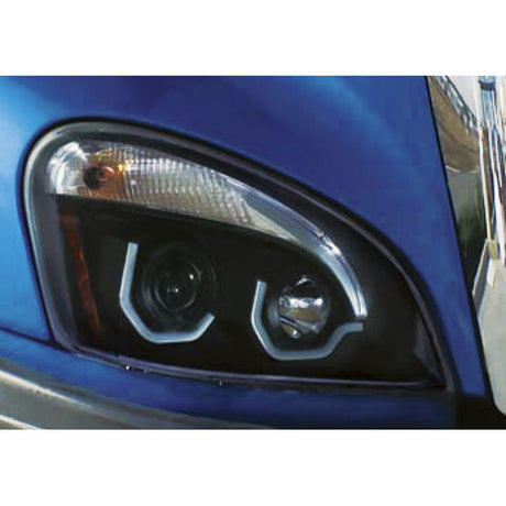 Close-up of Freightliner Cascadia blackout projection halogen headlight with LED