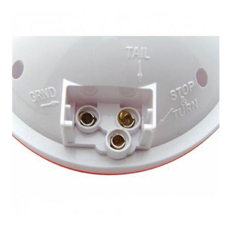Close-up of universal 4" round dual function incandescent turn signal light