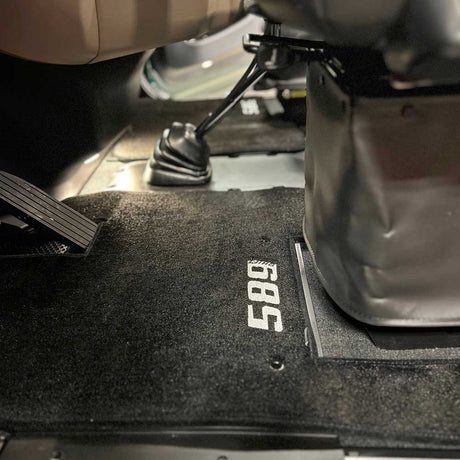 Close-up of Peterbilt 589 carpet two piece black floor mats