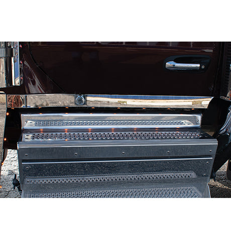 Peterbilt 589 cab panel underlit with eight amber/clear LED and block heater cutout, close-up