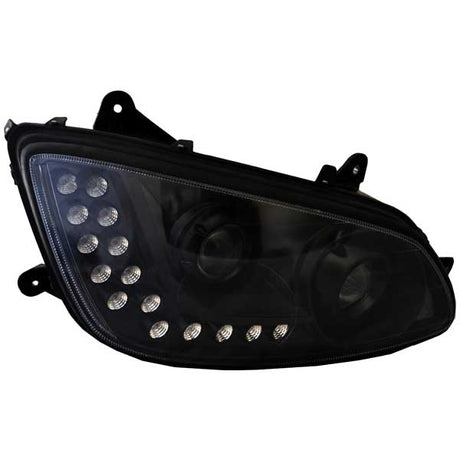 Close-up of Kenworth T660 blackout projector and LED headlights